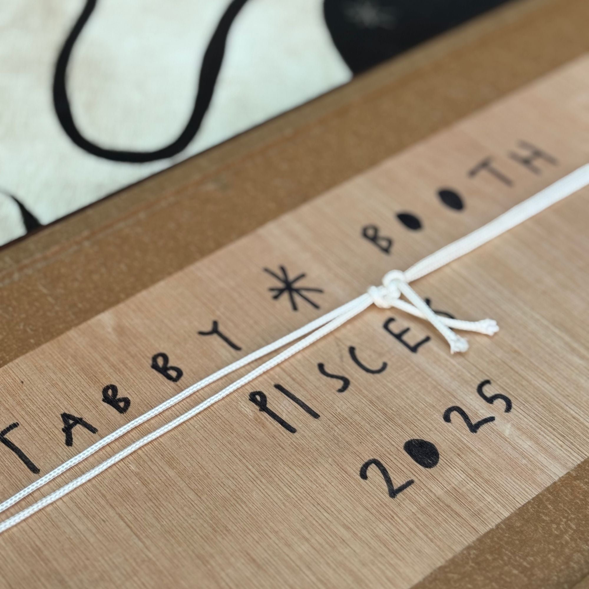 tabby-booth-pisces-signature